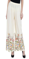 Off white palazzo pants featuring a subtle floral pattern