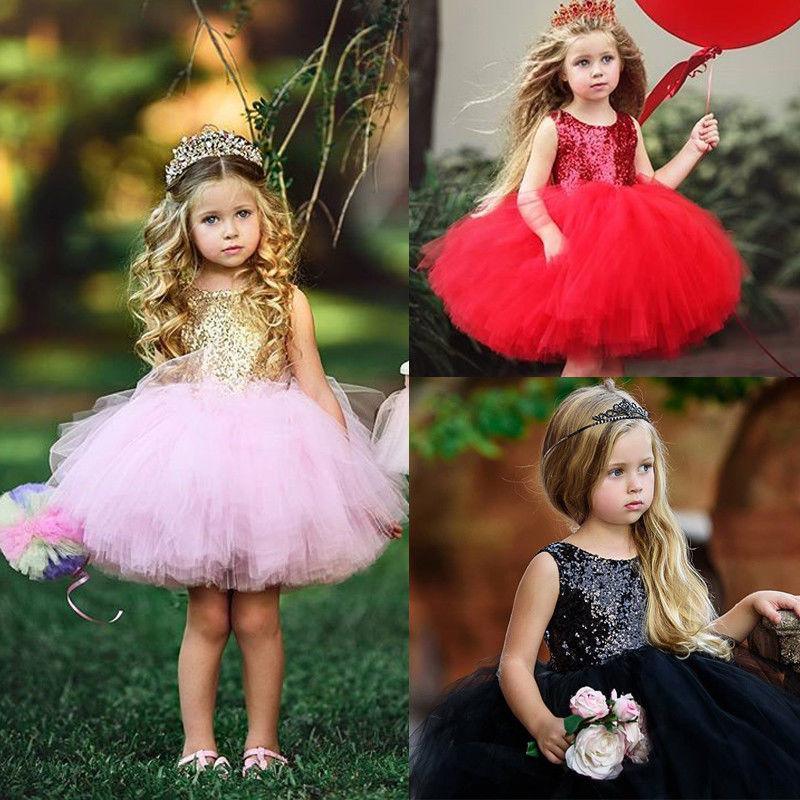 A glamorous baby girl party dress featuring sequin bodice and a full tulle tutu skirt.