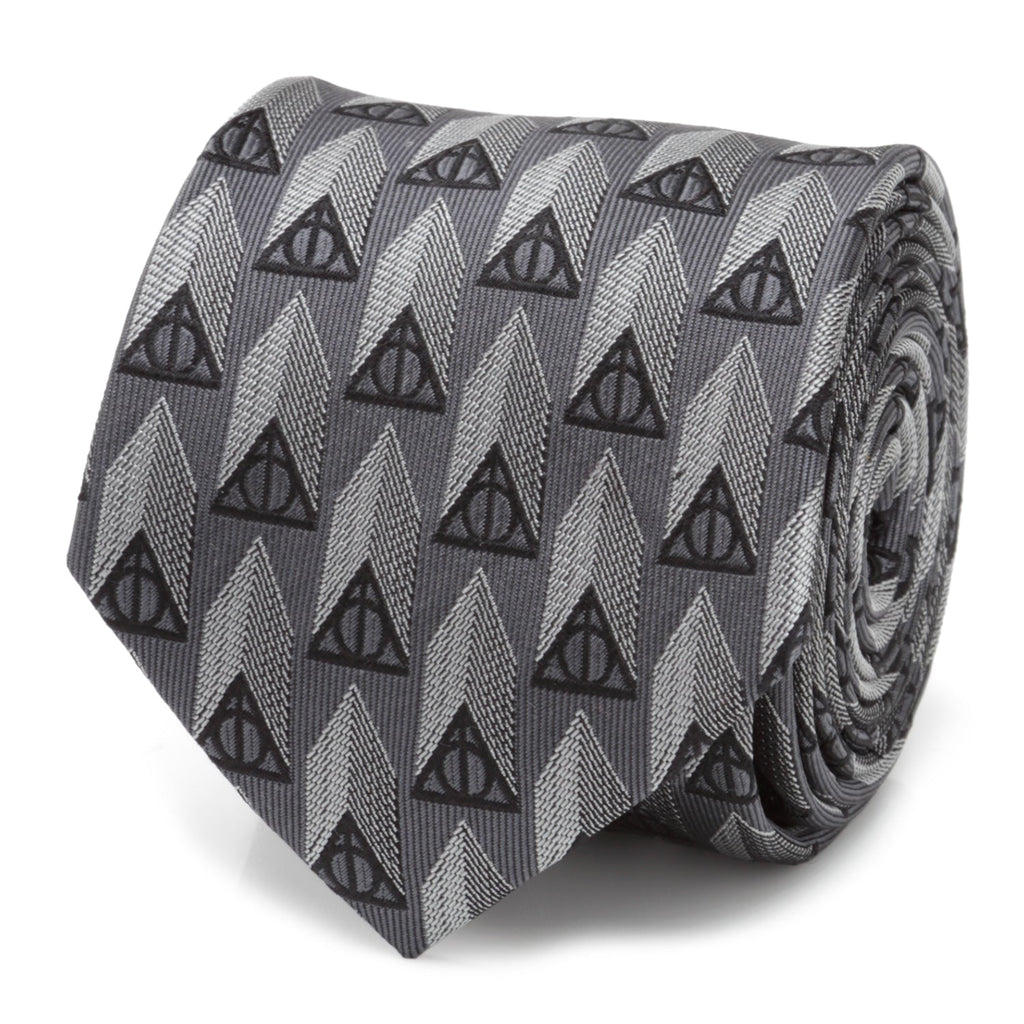 Close up of a gray silk necktie featuring a repeating black Deathly Hallows symbol pattern.