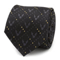 A rolled black silk necktie featuring a repeating Golden Snitch pattern and gold dot accents from Harry Potter.