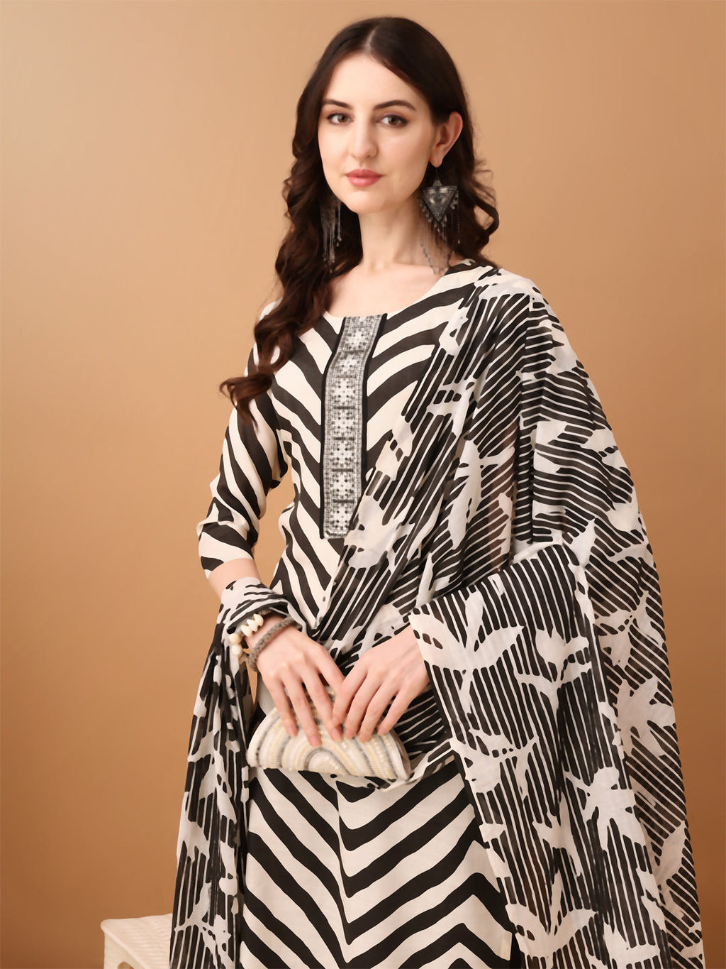 Black embroidered cotton kurta paired with a matching pant and printed dupatta