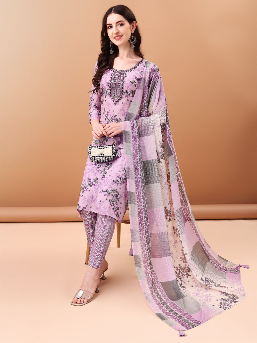 Elegant lavender kurta set with floral prints, embroidery, and matching dupatta.