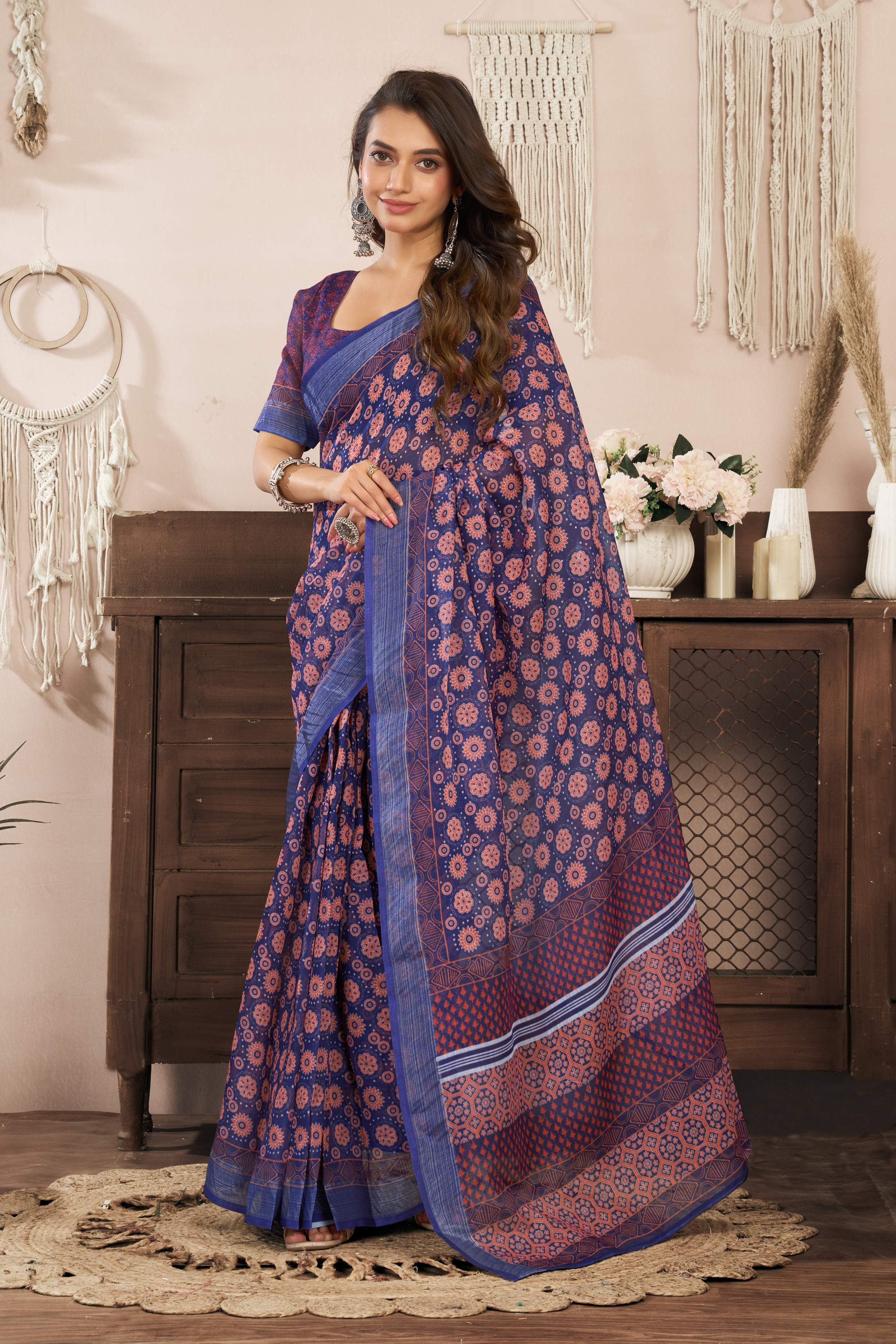 A blue printed ready-to-wear linen saree featuring an unstitched blouse.
