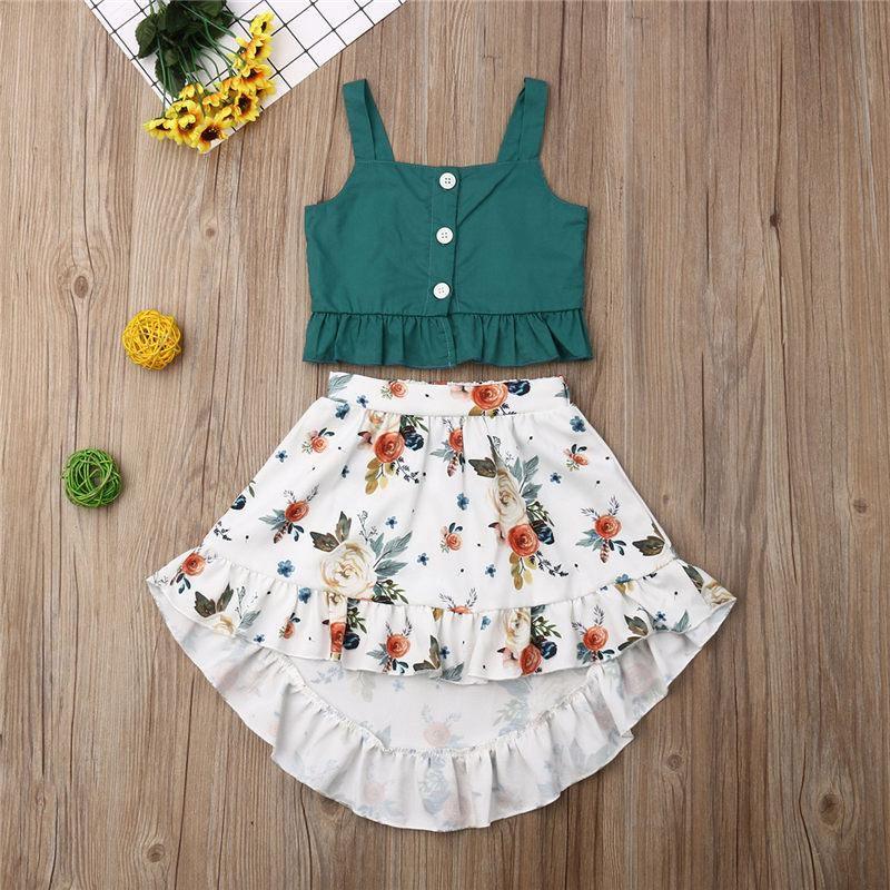 Baby girl wearing a teal and white floral ruffle top and bloomers set