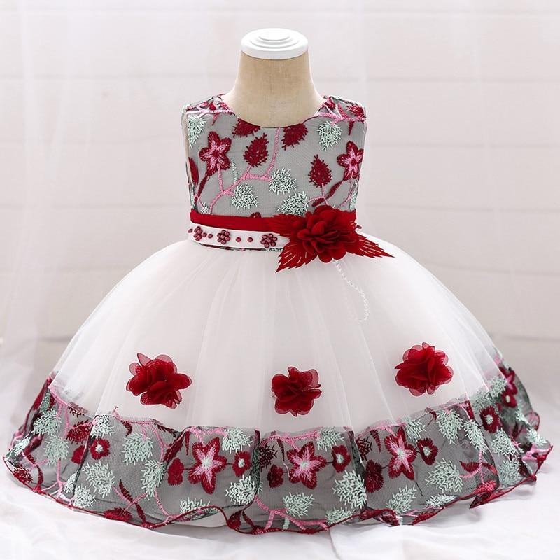 Baby girl wearing a luxury handmade lace and tulle sleeveless party dress with 3D flower embroidery