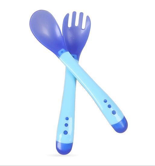 Soft silicone baby fork and spoon set in solid colors for infant self-feeding