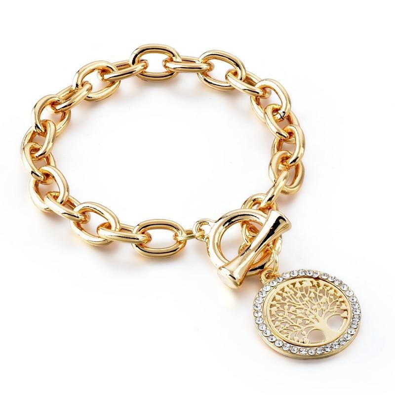 Gold tone expandable medallion bracelet featuring a Tree of Life design