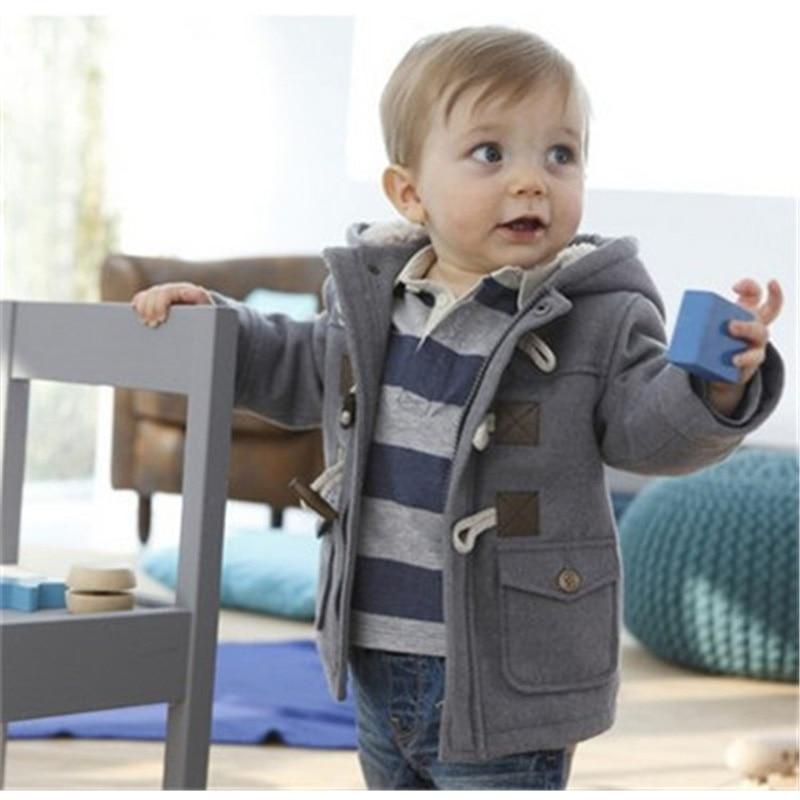 Infant boy wearing a classic cotton blend hooded jacket with toggle and zipper