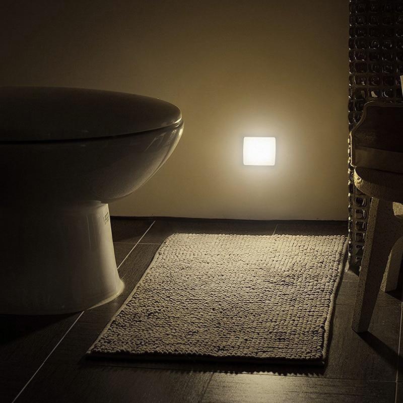 Minimalist small square white motion sensor LED night light for modern home interiors