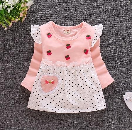 A selection of cute sleeveless girls' dresses in various spring colors like yellow and mint-green