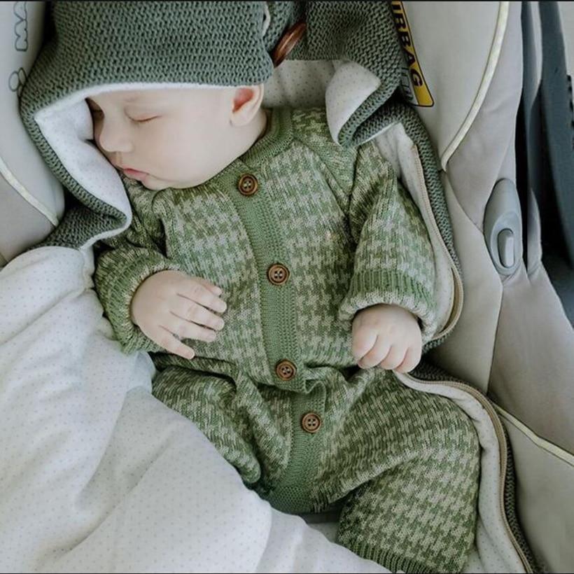 Baby wearing a soft knitted cotton romper and a matching plaid hat