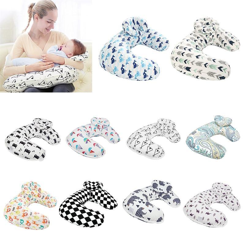 Modern U-shaped nursing pillow in soft cotton with diverse nursery-friendly prints