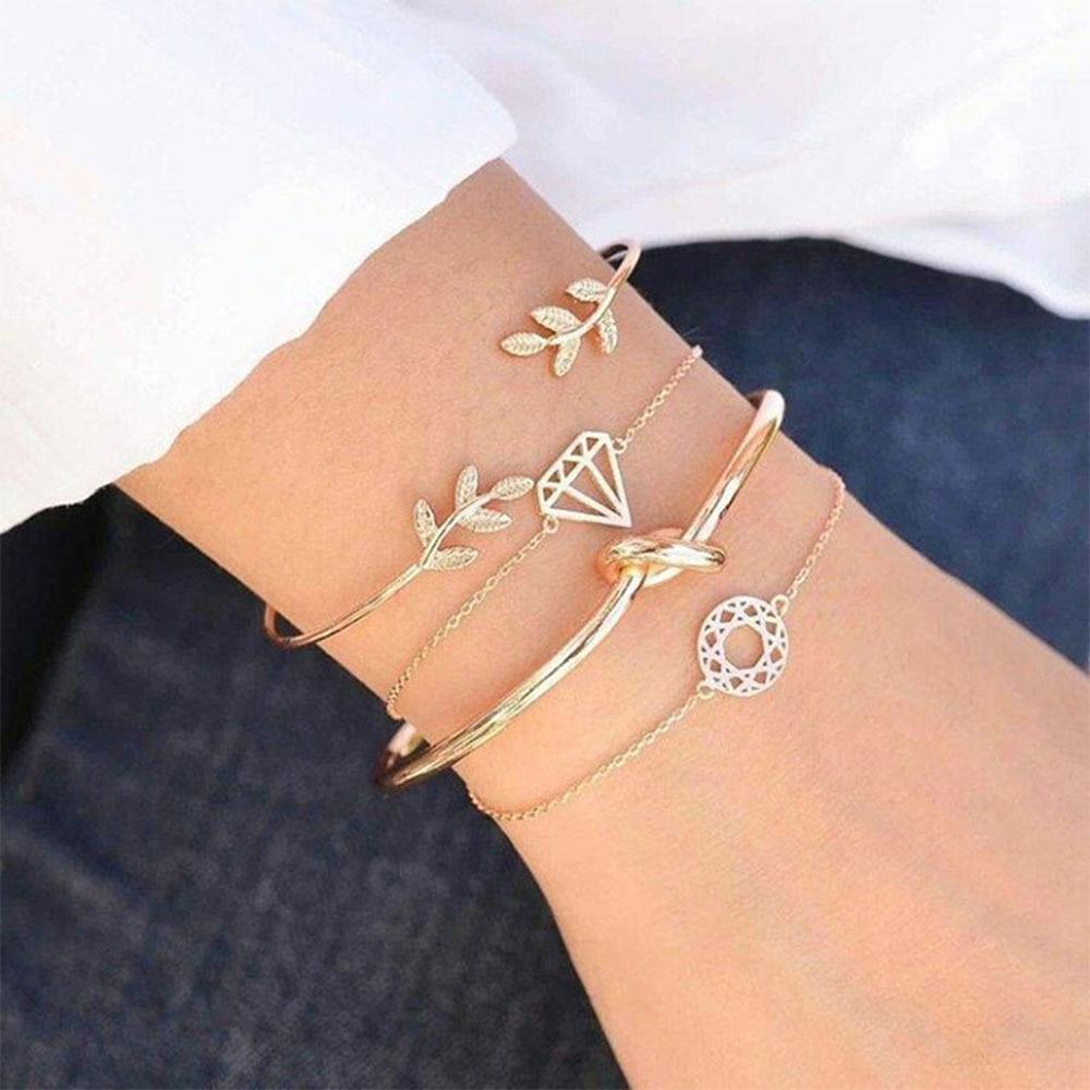 Bohemian style gold-tone leaf and geometric knot cuff bangle