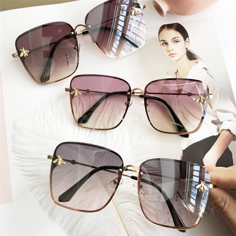 Glamorous oversized square sunglasses with metal frames and gradient lenses for women.