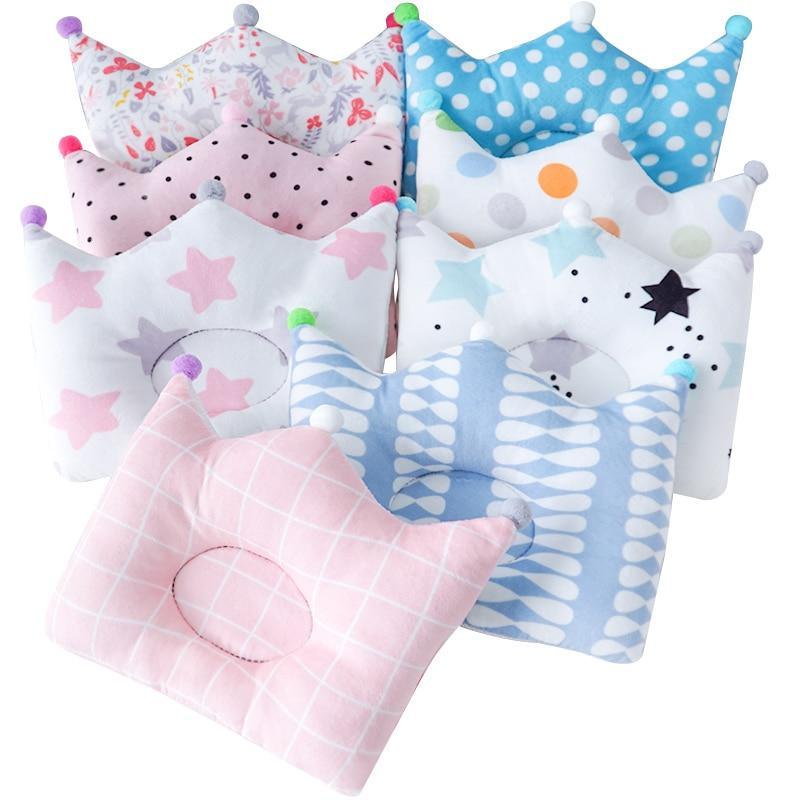 A soft, pastel-colored cotton throw pillow in a nursery setting, perfect for modern kids room decoration.