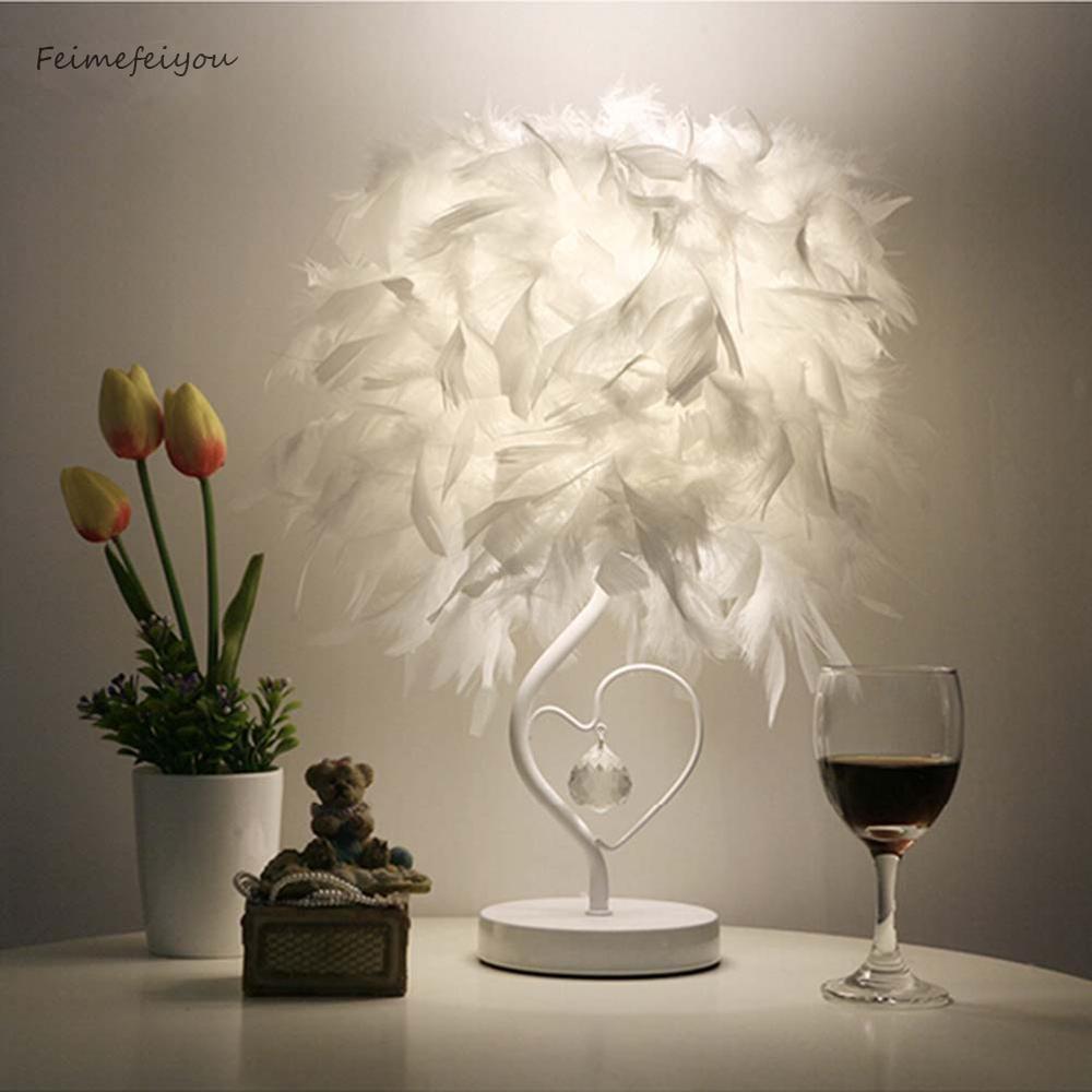 Romantic heart-shaped table lamp with feathers and crystal accents, available in white and pink