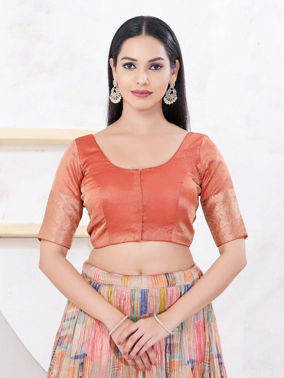 Copper Brocade sleeveless blouse with round neck and front opening