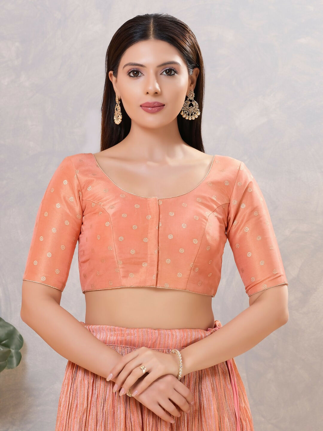 Peach silk stitched blouse with a round neckline