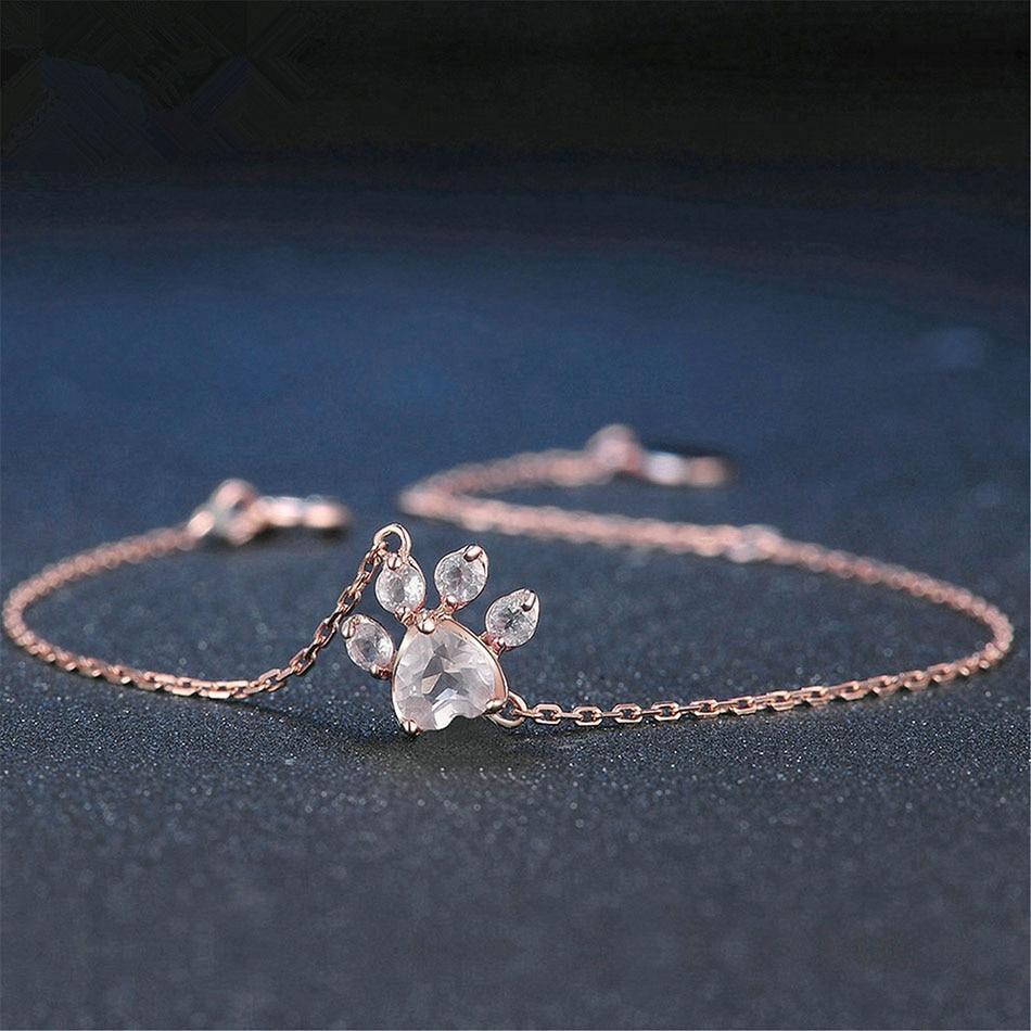 Rose gold chain bracelet with a pink heart, pet paw print, and sparkling cubic zirconia