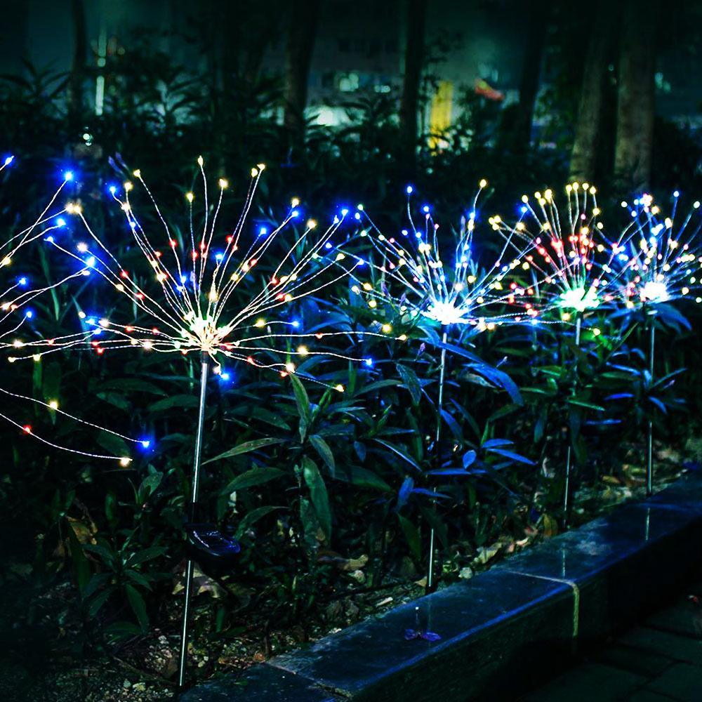 Modern luxury solar LED firework garden lamp with flexible silver copper wires shaped like a burst of light.