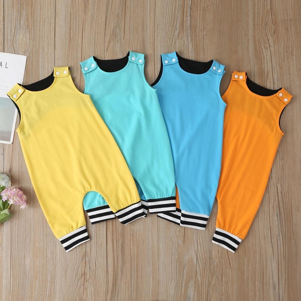 Baby wearing a solid color sleeveless cotton romper with contrast leg cuffs