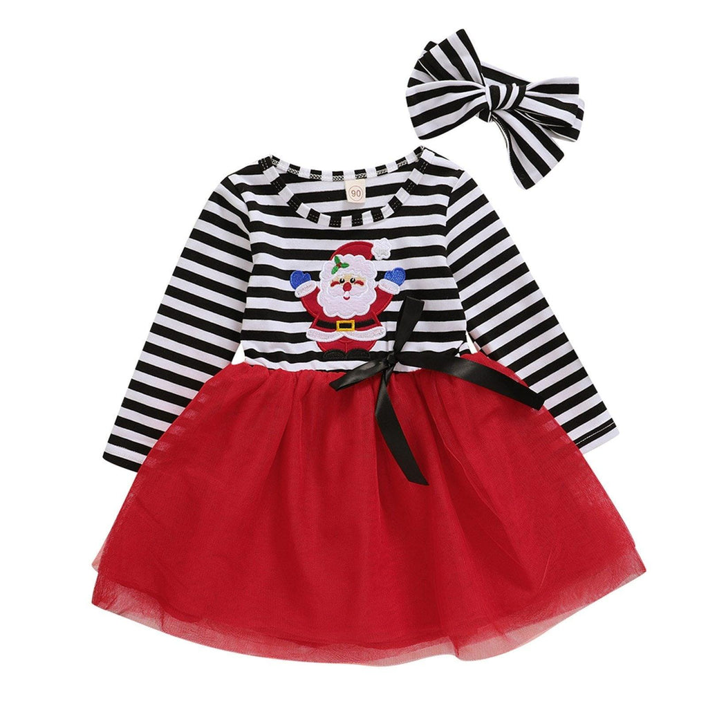 Baby girl wearing a festive Christmas Santa striped dress with a matching headband