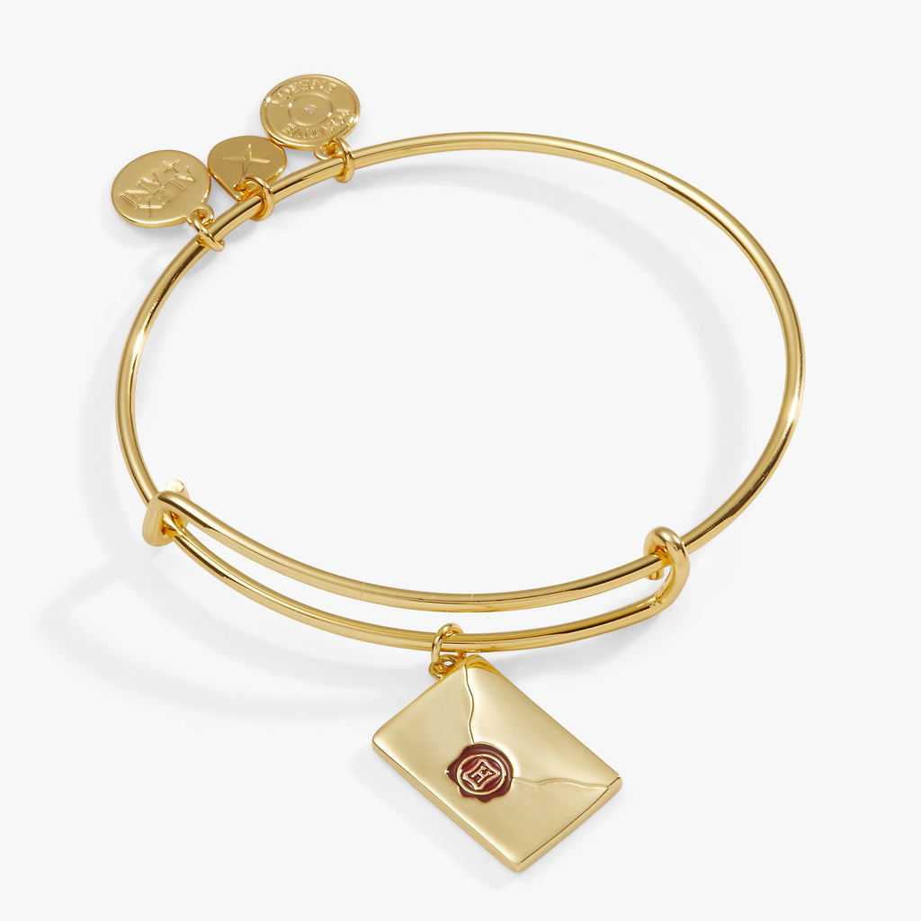 Shiny gold Harry Potter acceptance letter charm bangle with Hogwarts envelope detail