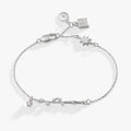 Sterling silver Harry Potter wand charm bracelet with crystal accents on an adjustable chain.