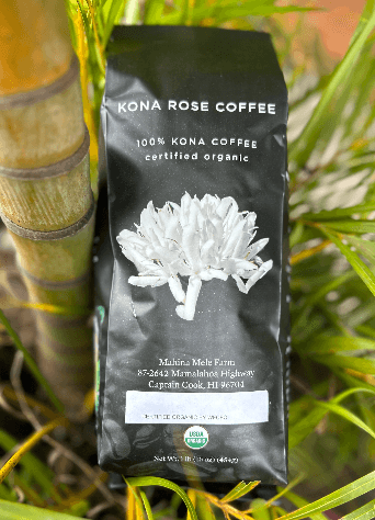 Kona Rose Coffee package with a white flower graphic on a green leaf background
