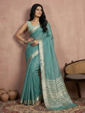 Close up of a deep Teal cotton saree with a matching blouse