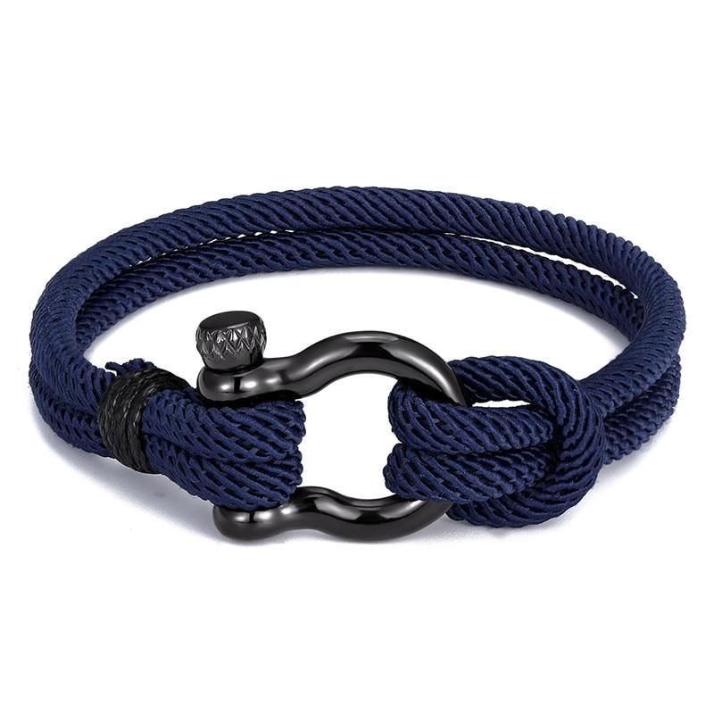 Modern navy rope bracelet with black stainless steel clasp on a neutral background