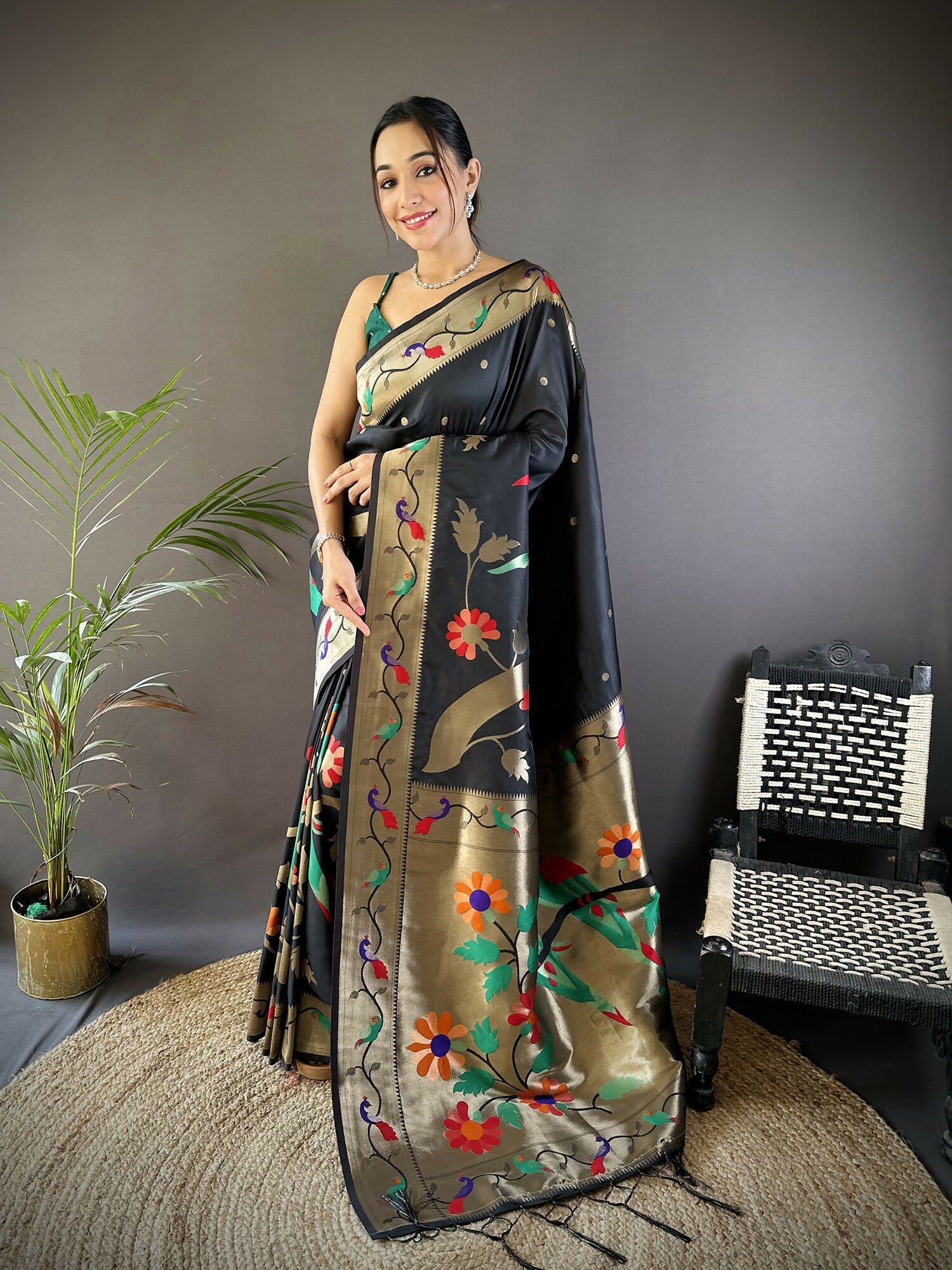Black soft silk Paithani saree with intricate gold zari woven floral motifs