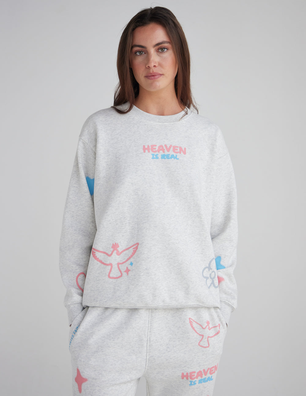 Unisex crewneck sweatshirt featuring HEAVEN IS REAL text in a casual streetwear style