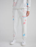 Unisex Heaven Is Real sweatpants in heather grey with pastel graphic accents on a model