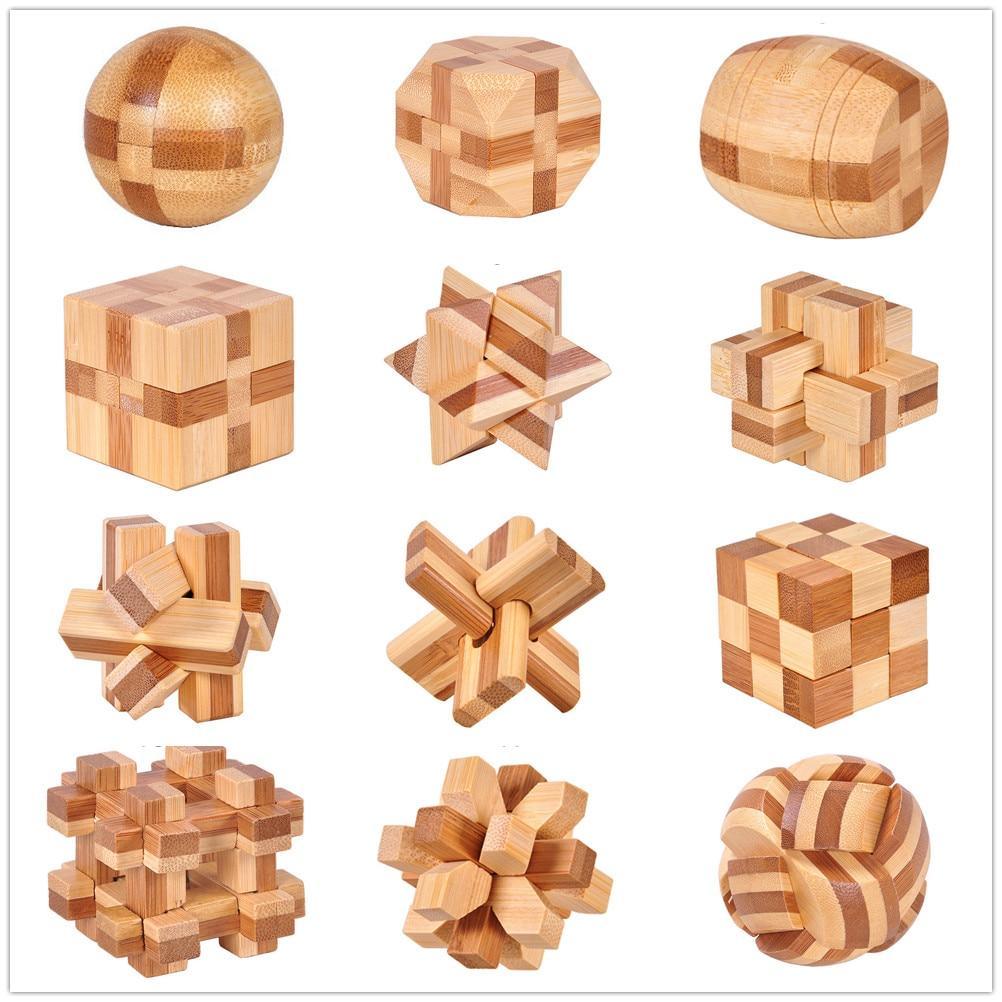 Small-scale 3D wooden interlocking brain teaser puzzle in light and brown bamboo wood tones.