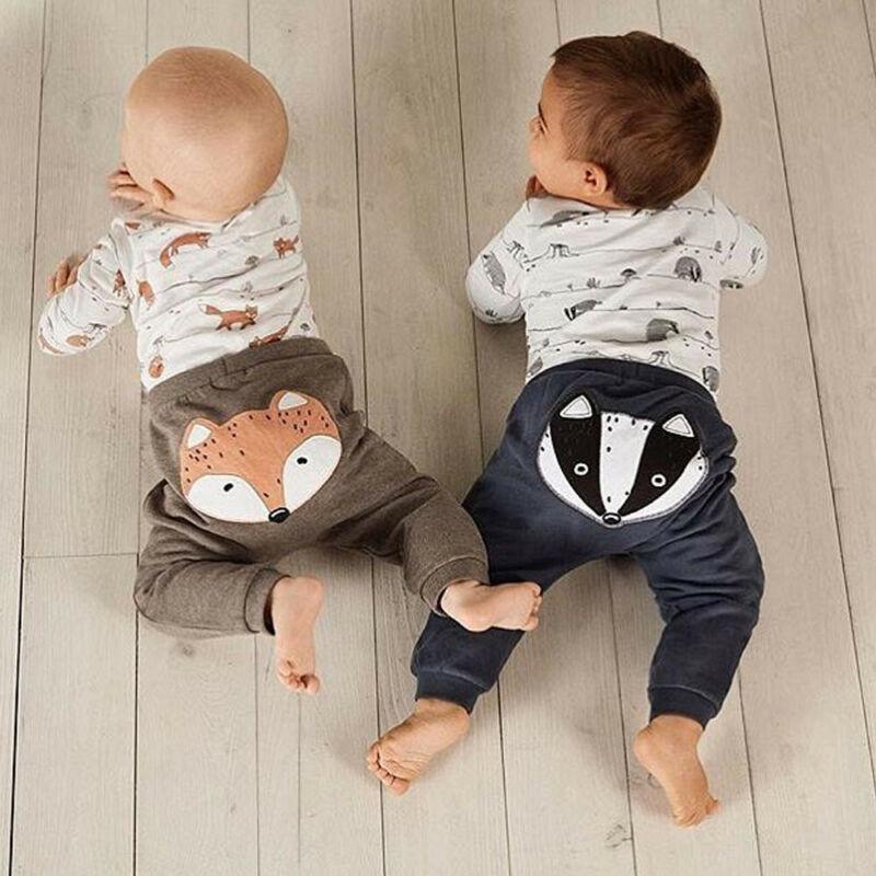 Modern fox print hooded sweatshirt paired with striped pants for babies.
