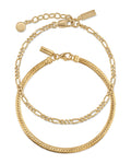 A luxurious 14k gold set featuring a flat herringbone chain and a classic Figaro chain bracelet styled together.