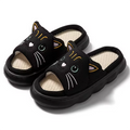 A pair of cozy black cat-themed indoor slide slippers for kids featuring a cute kawaii design.