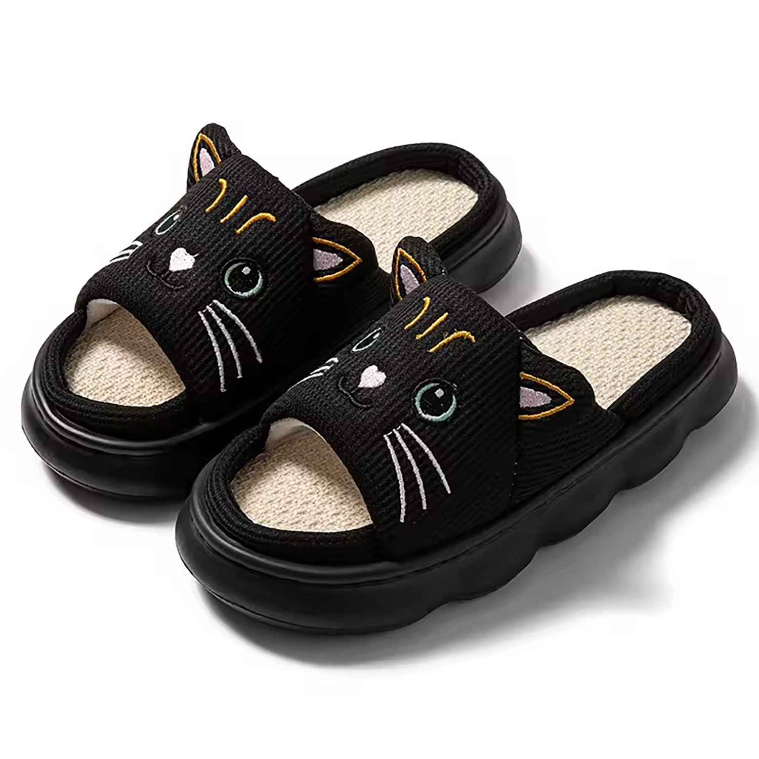 A pair of cozy black cat-themed indoor slide slippers for kids featuring a cute kawaii design.