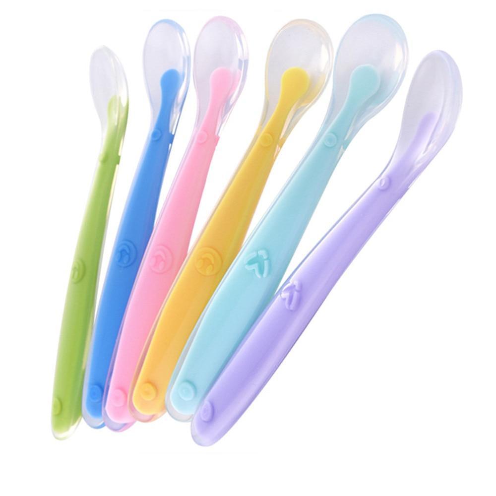 Brightly colored silicone baby feeding spoon for toddler self-feeding training