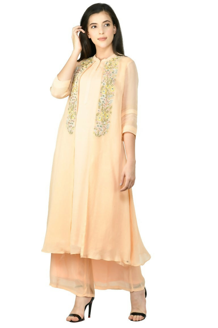 A soft peach colored 2-piece viscose kurta set for women