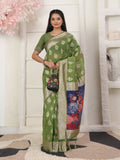 Classic green linen cotton saree with matching green blouse.