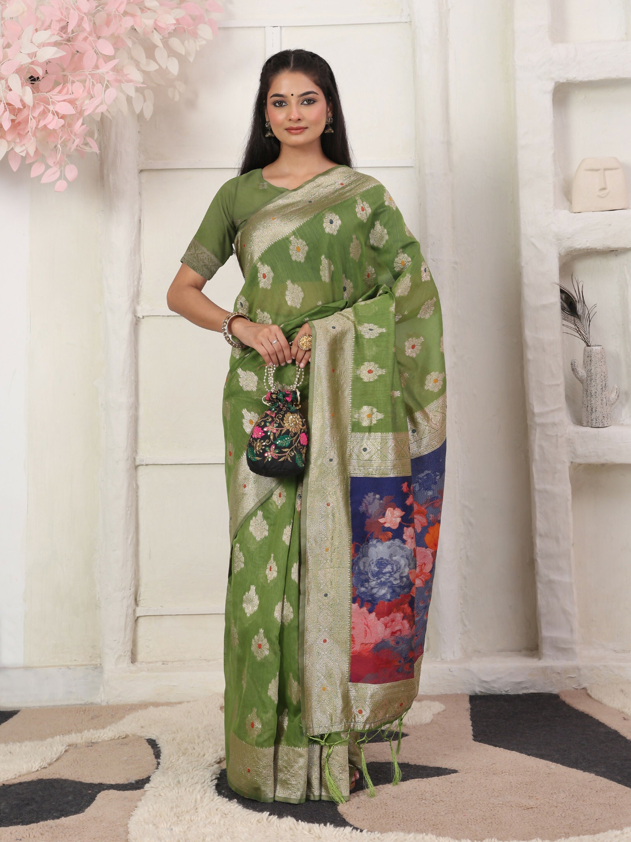 Classic green linen cotton saree with matching green blouse.
