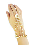 A close-up of a gold-plated Kundan pearl chain Hathphool bracelet in crème and gold, showing intricate bead and pearl details.