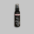 2oz black spray bottle of Hot Doe Urine with white text for outdoor hunting use