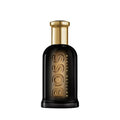 Bottled Elixir Parfum in a sleek black glass bottle with metallic gold accents.