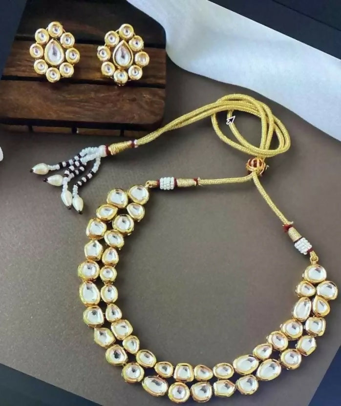 White Kundan necklace set with gold-plated finish and adjustable cord