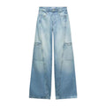 High-waist wide-leg light wash blue denim jeans with decorative front seam detailing.