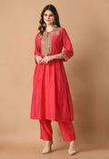 Model wearing a red Chanderi kurta set with matching bottom and translucent organza dupatta