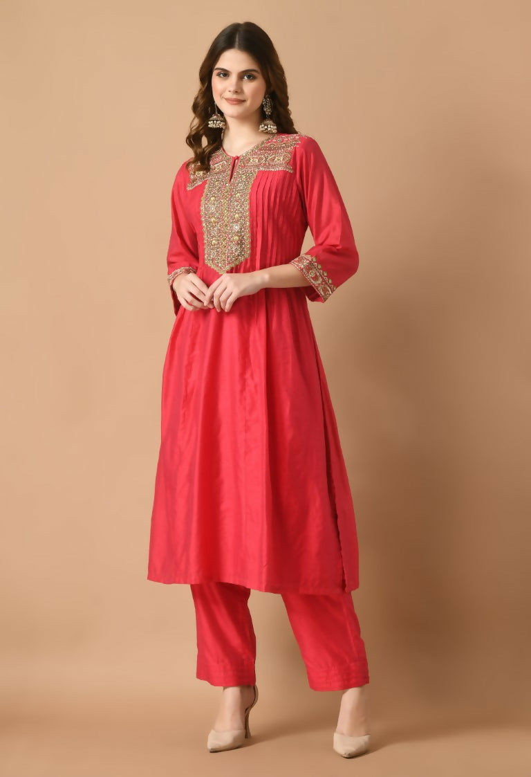 Model wearing a red Chanderi kurta set with matching bottom and translucent organza dupatta